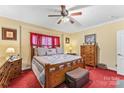 Cozy bedroom featuring a patterned quilt, wood furnishings, and neutral walls at 3951 Springs Rd, Conover, NC 28613