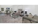 Bright and airy living room with neutral tones, contemporary furnishings, and large windows at 3663 Mercer St, Terrell, NC 28682
