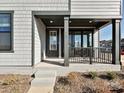 An inviting front porch features a covered entryway, and steps leading to a door with sidelights and the house number at 139 Armstrong Rd, Belmont, NC 28012