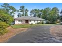 Ranch house with a circular driveway and mature trees at 1626 S Wendover Rd, Charlotte, NC 28211