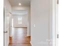 Bright hallway with hardwood floors, leading to living areas at 2070 Van Buren Rd, Sherrills Ford, NC 28673