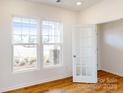 Home office with hardwood floors, built-in shelving and large windows at 2070 Van Buren Rd, Sherrills Ford, NC 28673