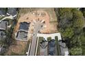 New construction homes nestled on a cul-de-sac lot, surrounded by green space and modern neighborhood design at 1211 Royal Prince Ct, Charlotte, NC 28211