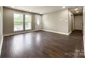 Bright living room with hardwood floors and neutral walls, offering a spacious and airy feel at 4230 Northaven Dr, Charlotte, NC 28206