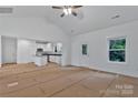 Spacious living area with vaulted ceilings, a modern kitchen, and an open layout at 6169 Long Branch Rd, Salisbury, NC 28147