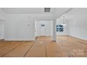 Bright living room featuring white walls, large windows, and an open floor plan at 6169 Long Branch Rd, Salisbury, NC 28147