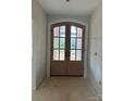 Elegant entryway featuring arched double doors with glass panels, providing natural light and inviting access to the home at 1500 Crowders Creek Rd, Gastonia, NC 28052