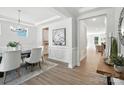 Elegant dining room featuring hardwood floors, modern decor, and bright, airy lighting at 2024 Cedar Falls Dr # 9, Waxhaw, NC 28173