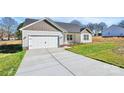 Beautifully built, white single-story home boasting an attached garage and well-manicured lawn at 6187 Long Branch Rd, Salisbury, NC 28147