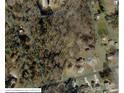 Aerial view showcasing the property's boundaries within a neighborhood setting, as well as surrounding trees at 2310 Montford Nw Ave, Concord, NC 28027