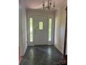 Welcoming foyer with a decorative door with sidelights and slate tile flooring at 2310 Montford Nw Ave, Concord, NC 28027