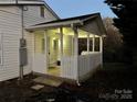 Back porch with white picket fence, covered porch, and view of the yard at 702 N 9Th St, Bessemer City, NC 28016