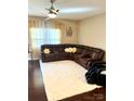 Cozy living room featuring plush carpeting, a large sectional, and plenty of natural light at 916 Roxburgh Ave, Rock Hill, SC 29732