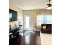 Comfortable living room with hardwood floors, a ceiling fan, and an abundance of natural light at 916 Roxburgh Ave, Rock Hill, SC 29732