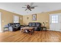 Cozy living room with hardwood floors, ceiling fan and a door to the exterior at 927 Kearney Dr, Shelby, NC 28152