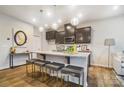 Modern kitchen with granite countertops and an island with seating at 5104 Carrick St, Charlotte, NC 28213