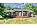 Charming brick ranch home with a welcoming front porch at 2909 Eastway Dr, Statesville, NC 28625