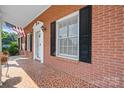 Brick front porch with patterned tile floor at 2909 Eastway Dr, Statesville, NC 28625