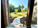 View from the porch steps, showing a charming walkway and landscaped front yard at 859 Tamary Way # 34, Landis, NC 28088
