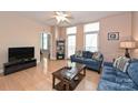 Living Room with hardwood floors, ceiling fan, and access to balcony at 1320 Fillmore Ave # 311, Charlotte, NC 28203