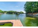 Beautiful waterfront view with a private dock and gazebo on a sunny day at 2518 Wellesbourne Ln, Sherrills Ford, NC 28673