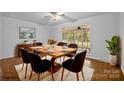 Dining room features a wood table, six chairs, and access to screened porch at 3338 Passmore Rd, Rock Hill, SC 29730