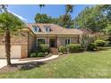 Brick home with a palm tree, manicured lawn, and welcoming front steps at 426 Saint Michaels Way, Fort Mill, SC 29708