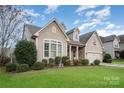 Charming one-story home with landscaped lawn and attached garage at 7037 Hyde Park Dr, Indian Trail, NC 28079