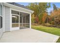 Screened porch and patio area, overlooking a wooded backyard at 8336 Acadia Pkwy, Sherrills Ford, NC 28673