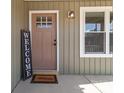 Close up view of the front door entrance with welcome mat at 528 Moss Springs Rd, Albemarle, NC 28001