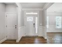 Bright entryway with hardwood floors and white trim at 5308 Verona Rd # 75, Charlotte, NC 28213