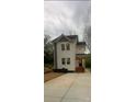 Charming two-story home with a well-manicured lawn and inviting entrance at 1137 6Th St, Lancaster, SC 29720