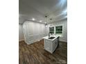Kitchen island with sink and faucet, complemented by custom wall paneling at 1137 6Th St, Lancaster, SC 29720