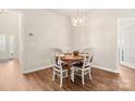 Cozy dining area with hardwood flooring, chandelier, and seating for four at 2105 Kennedy Dr, Indian Land, SC 29707