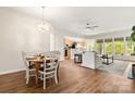 Open floor plan living space with dining area, ceiling fan, and large windows at 2105 Kennedy Dr, Indian Land, SC 29707