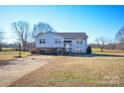 Charming two-story home with a well-maintained lawn, spacious driveway, and a basketball hoop for outdoor fun at 2725 Carla Dr, Shelby, NC 28150