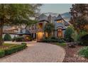 Elegant two-story home with stone accents and landscaped grounds at 300 Eagle Bend Dr, Waxhaw, NC 28173