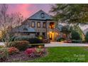 Stunning home with stone and brick facade, beautifully landscaped at 300 Eagle Bend Dr, Waxhaw, NC 28173