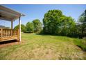Spacious backyard with lush green grass and mature trees, perfect for outdoor activities and relaxation at 4684 Hopsack Dr # Cal0105, Indian Trail, NC 28079