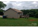 Image of the back of the house showing a small deck and wooded area at 2290 9Th Avenue Ne Dr, Hickory, NC 28601