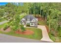 Areal view of a beautiful single Gathering home with stone and stucco exterior surrounded by mature trees at 7245 Static Way, Sherrills Ford, NC 28673