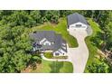 Aerial view of a home with detached garage and expansive lawn at 5811 Kristi Ln, Midland, NC 28107