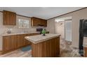 Kitchen with island and ample cabinetry at 850 Mereva Rd, Smyrna, SC 29743