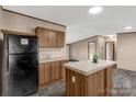 Modern kitchen with black appliances and island at 850 Mereva Rd, Smyrna, SC 29743