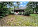 Quaint front porch with brick accents, white railing and porch that extends across the front of the house at 9143 Sadlers Ridge Rd, Fort Mill, SC 29707