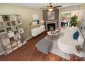 Stylishly staged living room with fireplace, modern furniture, and hardwood flooring at 6003 Heath Valley Rd, Charlotte, NC 28210