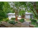 Home with a spacious driveway, large garage and beautiful landscaping at 3020 Poplar Hill Rd, Charlotte, NC 28270