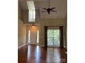 Bright living room with hardwood floors and high ceilings at 4817 Mossy Cup Ln, Monroe, NC 28110