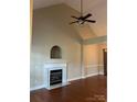 Living room features a marble fireplace and hardwood floors at 4817 Mossy Cup Ln, Monroe, NC 28110