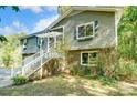 Brick and gray house with white stairs and landscaping at 5601 Indian Brook Dr, Matthews, NC 28104